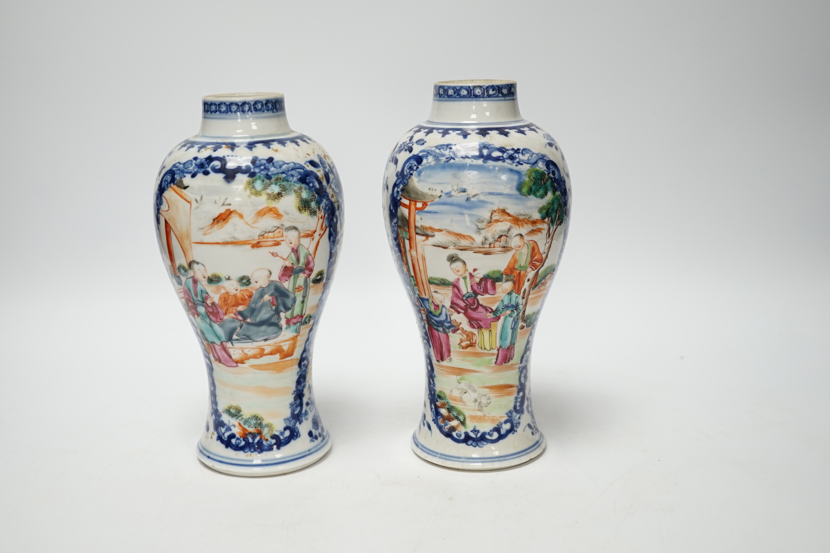 A pair of late 18th century Chinese famille rose ‘mandarin’ vases, 19cm high
